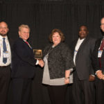 John Rossiter, Security Administrator, Security and Exchange Commission, Michael Madsen, AST Publisher presenting an award, Janet White, Education Program Director, U.S. Office of Personnel Management; Kevin McCombs, Security Specialist, U.S. Office of Personnel Management; and Reid Hilliard, of the Department of Justice