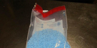 A package holding 6,767 oxycodone pills was pulled from car.