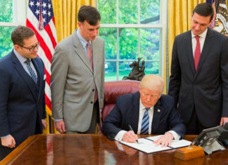 President Donald J. Trump is joined by, from left to right, Josh Steinman, Rob Joyce and Tom Bossert, as he signs an Executive Order for Strengthening the Cybersecurity of Federal Networks and Critical Infrastructure (EO 13800). (Courtesy of Twitter)