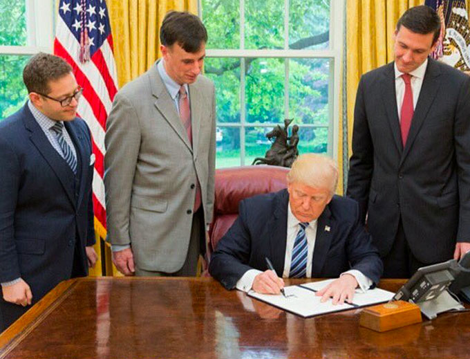 President Donald J. Trump is joined by, from left to right, Josh Steinman, Rob Joyce and Tom Bossert, as he signs an Executive Order for Strengthening the Cybersecurity of Federal Networks and Critical Infrastructure (EO 13800). (Courtesy of Twitter)