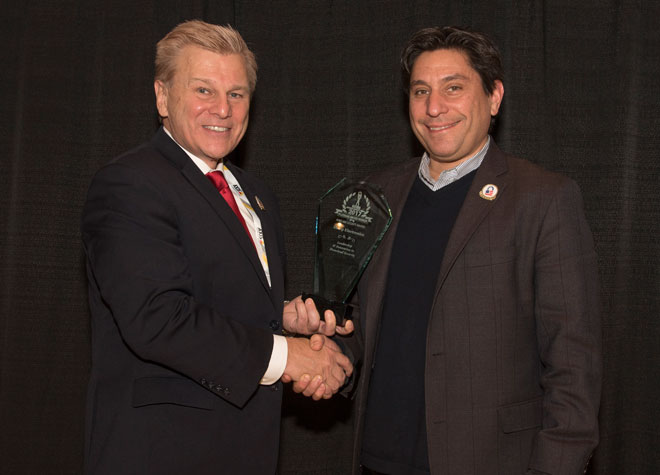 Michael Madsen, AST Publisher, presenting Cliff Quiroga, Vice President for Sharp Robotics Business Development with the Sharp Electronics, 2017 ‘ASTORS’ “Leadership & Innovation in Homeland Security” Award