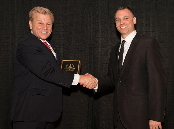 Phillip Kirsch, General Manager, Cherry Americas LLC, receives a Platinum Award for the 2017 Homeland Security Awards from Michael Madsen, publisher of American Security Today.