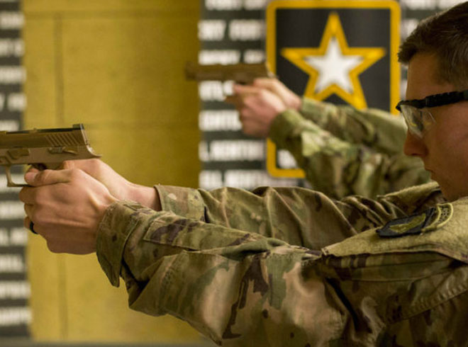 A soldier with the 1st Brigade Combat Team, 101st Airborne Division, fires the Army’s new Modular Handgun at Fort Campbell, Kentucky, on November 28, 2017 (Image courtesy of the DoD)