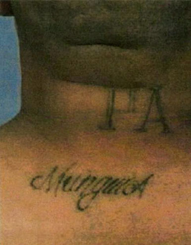 Munguia has the following tattoos: a teardrop near his left eye; the letters "PA" on the back of his neck; the word "Munguia" on his back; the words "My Baby Jessica" on his chest; and multiple additional tattoos on both of his arms, left leg, chest, and abdomen. He also has a scar near his left eye. Munguia is missing his right index finger.