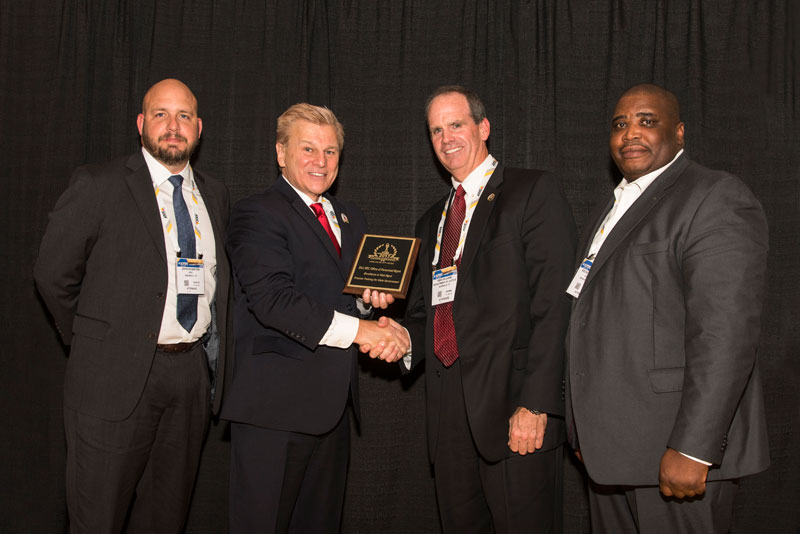 John Rossiter, Security Administrator, Security and Exchange Commission, Michael Madsen, AST Publisher presenting an award, Kevin McCombs Security Specialist DOJ Office of Personnel Management and Reid Hilliard, Department of Justice