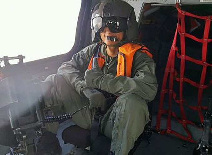 Seaman Gregory Jacquet on a training flight. Seaman Jacquet was selected as the 2016 Coast Guard Enlisted Persons - Active Duty Component of the Year (Image courtesy of the U.S. Coast Guard)