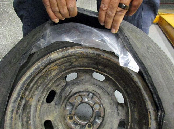 CBP officers at the San Ysidro port of entry discovered 37 wrapped packages of methamphetamine concealed in the spare tire, quarter panels and seats of a Honda Civic.