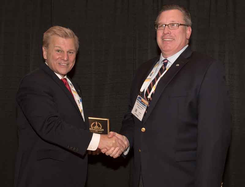 Charles Bohnenberger, Vice President of Government Services Business Development for Allied Universal, accepting a 2017 'ASTORS' Award at ISC East.