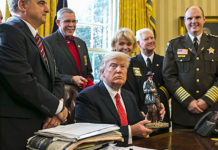 President Donald Trump, who made “law and order” a central issue of his campaign and enjoyed wide support among members of the law enforcement community, shown here meeting with a group from the National Sheriffs’ Association at the White House, delivering a letter of thanks for his recent executive actions to clamp down on illegal immigration.
