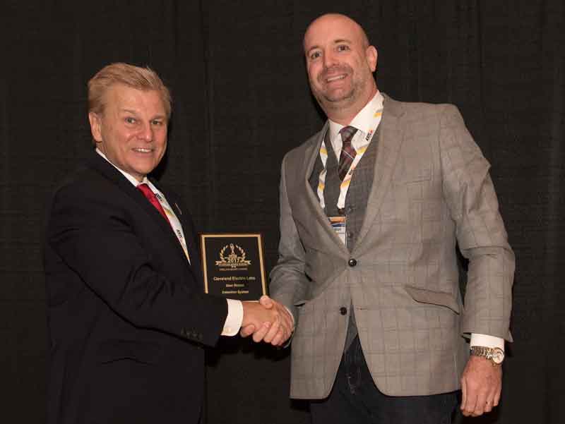 Alan Seymour, PhD of Cleveland Electric Laboratories receiving 'ASTORS' Award from Michael Madsen (L), Publisher of American Security Today