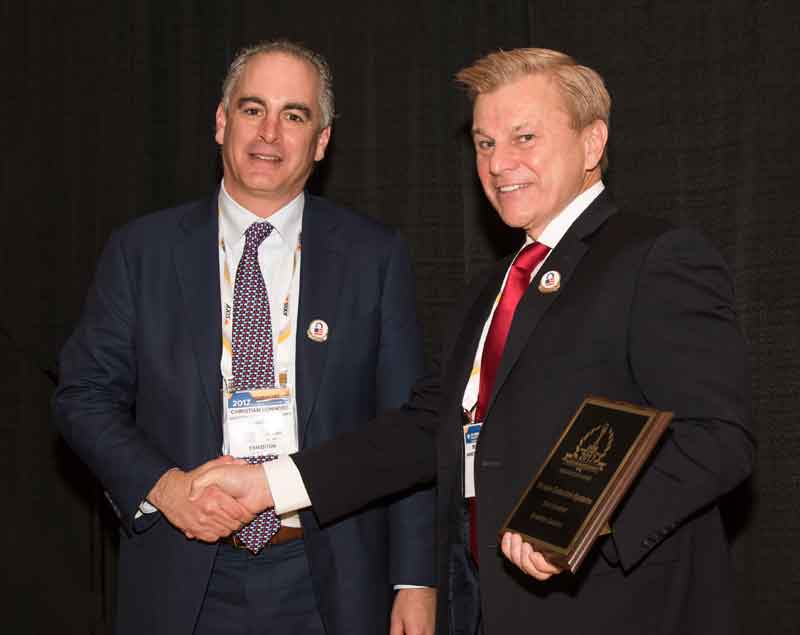 Christian Connors, SDS CEO accepting the company's 2017 'ASTORS' Award from Mike Madsen, AST Publisher, at ISC East.
