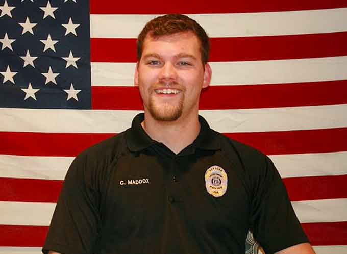 A Georgia police officer was killed Friday and two sheriff’s deputies were injured while serving an arrest warrant, police said. The slain officer was Chase Maddox, 26, Locust Grove Mayor Robert Price