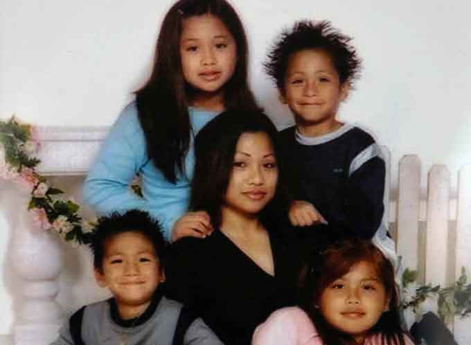 Sherryl Sacueza, (Center), with her children. Courtesy of the FBI.