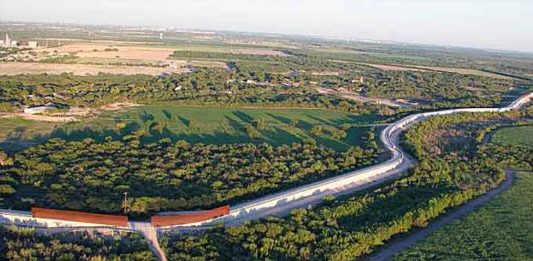 Department of Homeland Security’s FY 2017 Enacted Appropriations provided funding to construct 35 gates to close gaps in the existing 55 miles of levee and border wall in the Rio Grande Valley Sector. Pictured is an area near McAllen, Texas, from September 2013. (Image courtesy of Donna Burton)