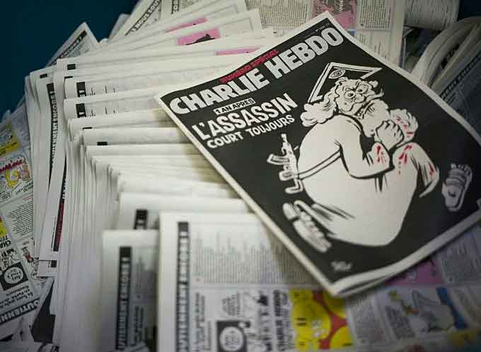 The cover of an edition of French satirical magazine Charlie Hebdo marking the first anniversary of the terror attack on the magazine's offices in Paris in January 2015. (Courtesy of AFP News)