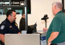 CBP officer is screening a passenger with new facial recognition passport screening technology at Miami-Dade Aviation Department (MDAD).