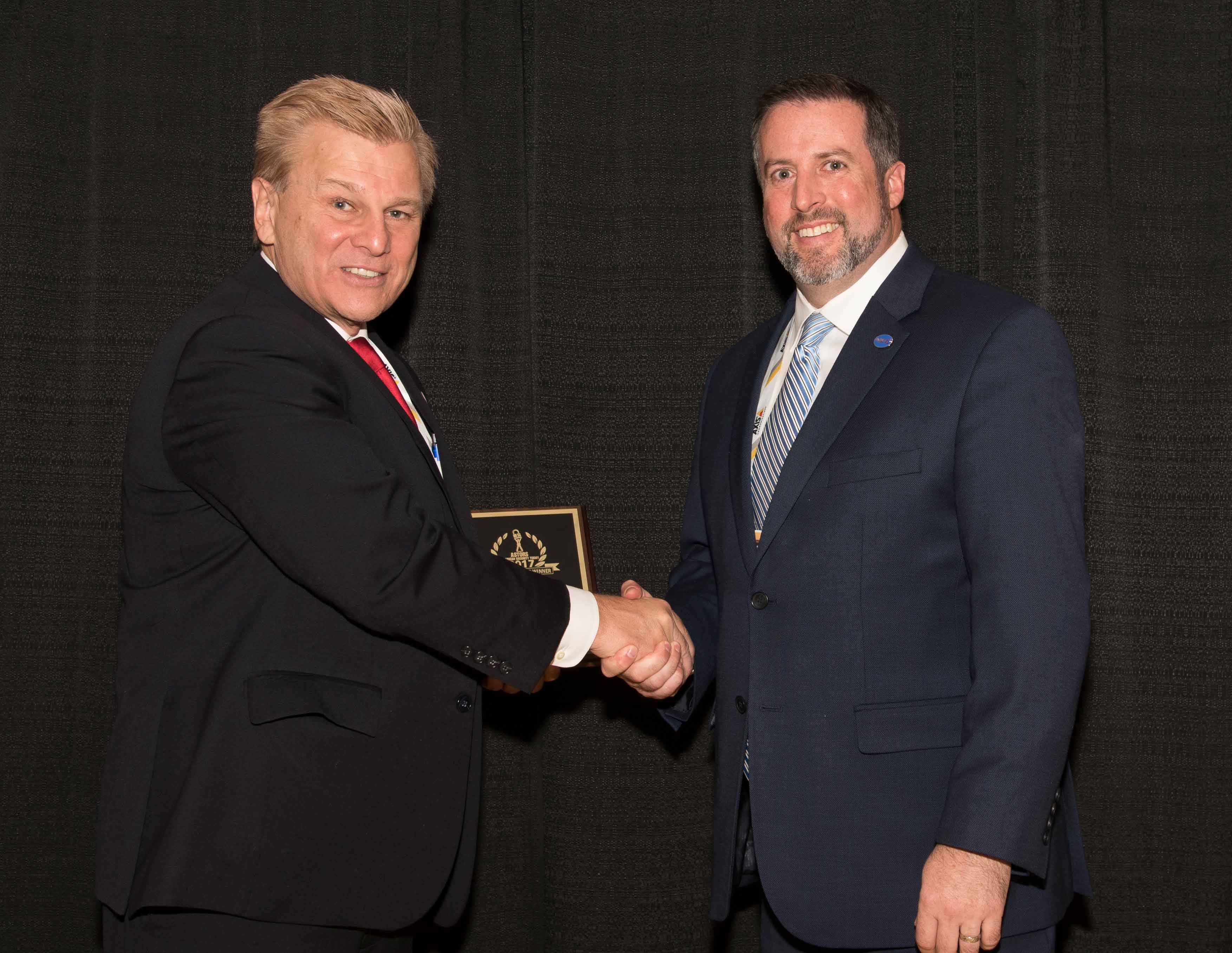 Bill Carleton, Senior Project Manager, Federal at NEC Corporation of America accepting the 2017 ‘ASTORS’ Award at ISC East.