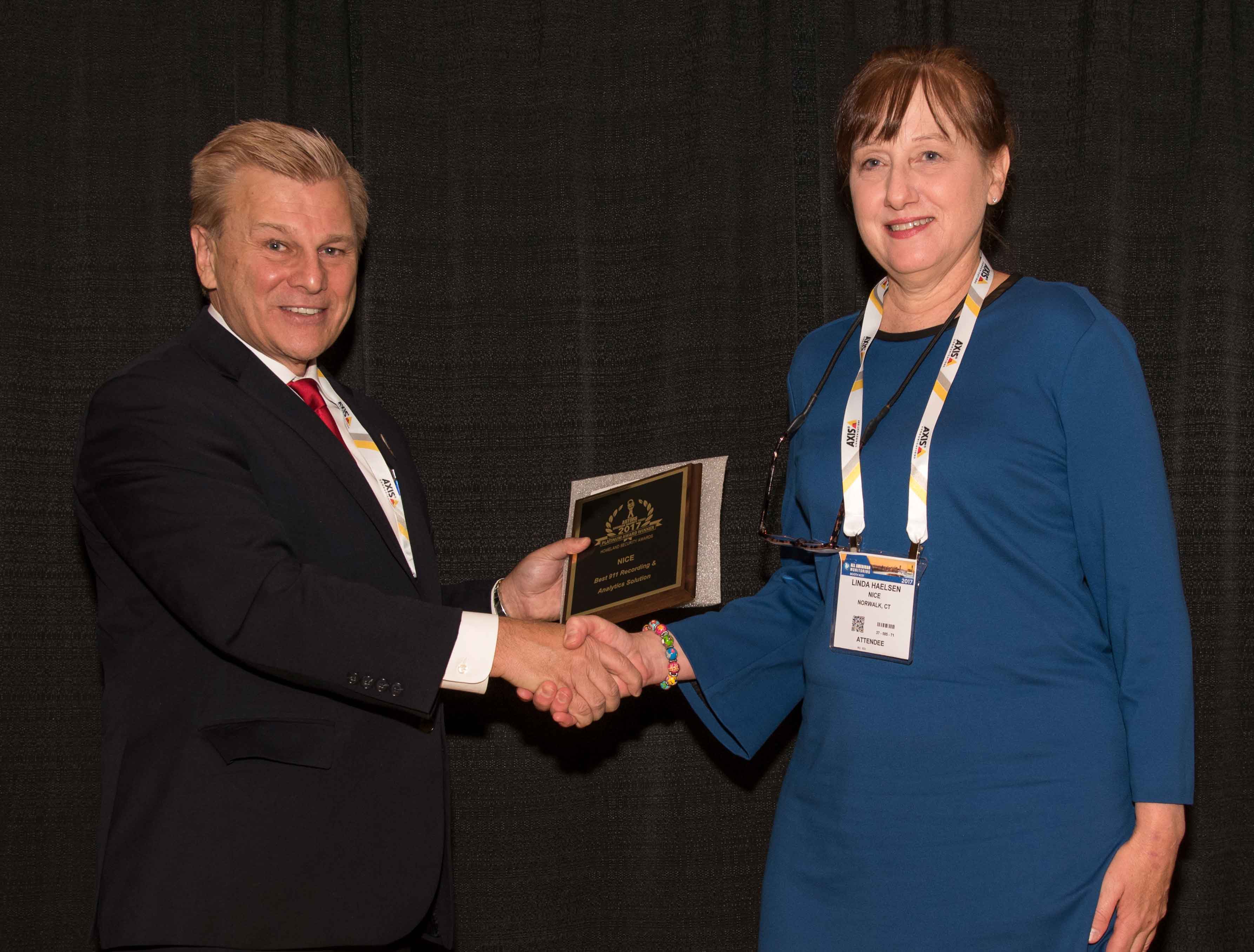 Linda Haelsen, NICE Marketing Communications Manager accepting the NICE 2017 ‘ASTORS’ Award at ISC East in New York City