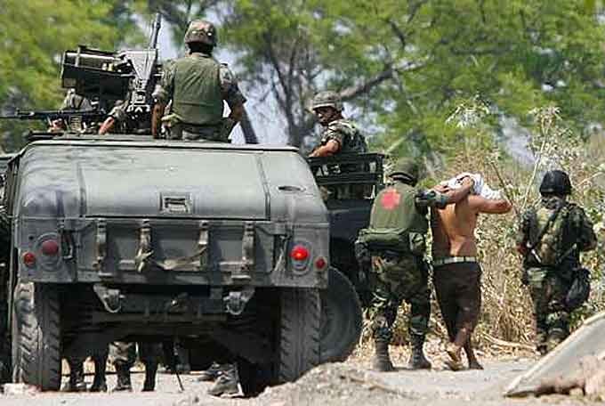 Mexican soldiers detain cartel suspects in Michoacán (Courtesy of Wikipedia)