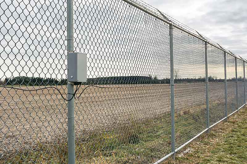 If supported by the fence-mounted sensor, distance or zone data can be used to direct surveillance cameras