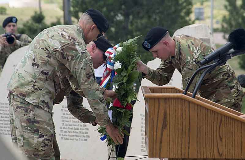 Army Maj. Gen. Randy A. George, 4th Infantry Division and Fort Carson commanding general, and Army Command Sgt. Maj. Timothy L. Metheny, 4th ID CSM, lay a memorial wreath in front of The Mountain Post Global War on Terrorism Fallen Soldiers Memorial during the Mountain Post Warrior Memorial Ceremony at Fort Carson, Colorado, on May 24, 2018. The annual ceremony serves to honor the memories of Fort Carson Soldiers who’ve lost their lives in operations overseas. (Courtesy of U.S. Army by Sgt. Justin Smith)