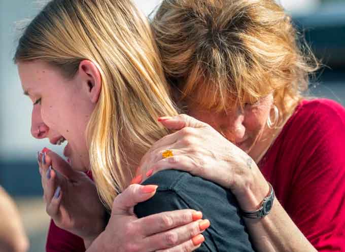 Dakota Shrader, a Santa Fe High School student being comforted by her mother Susan Davidson. (Courtesy of YouTube)