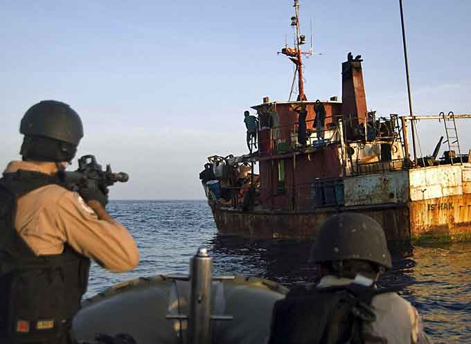 Coalition military forces prepare to board a vessel suspected of having pirates on board. (Courtesy of NATO)