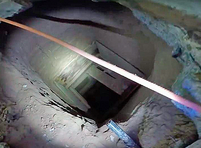 Homeland Security Investigations and Border Patrol agents have discovered a 590 feet long and 22 feet deep cross-border tunnel under a vacant Kentucky Fried Chicken restaurant in San Luis, Arizona, used to smuggle drugs via a rope system. (Courtesy of Homeland Security Investigations, Yuma Border Patrol and YouTube)