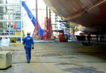  Lt. j.g. Ryan Thomas, a marine Inspector at Coast Guard Sector Delaware Bay, walks below the Kaimana Hila, an 850-foot container ship being constructed in Philadelphia Shipyards, Oct. 4, 2018. The Kaimana Hila and the Daniel K. Inouye are the two largest container ship ever built in the United States. During ship construction the Coast Guard works with the ship builder, shipping company and registrar in a unified effort to make the ship as safe as possible for operation. (Courtesy of USCG by Petty Officer 1st Class Seth Johnson)