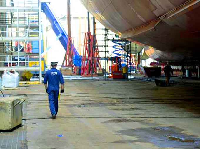  Lt. j.g. Ryan Thomas, a marine Inspector at Coast Guard Sector Delaware Bay, walks below the Kaimana Hila, an 850-foot container ship being constructed in Philadelphia Shipyards, Oct. 4, 2018. The Kaimana Hila and the Daniel K. Inouye are the two largest container ship ever built in the United States. During ship construction the Coast Guard works with the ship builder, shipping company and registrar in a unified effort to make the ship as safe as possible for operation. (Courtesy of USCG by Petty Officer 1st Class Seth Johnson)