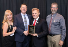 Tammy Waitt, AST Editorial Director, (left to right), Ben Shirley, Director of Marketing at Ameristar Perimeter Security, accepting one of Five 2018 'ASTORS' Awards from AST Publisher, Mike Madsen, at ISC East in New York City as Ameristar’s Jeff Halaut, Barrier Program Manager looks on.