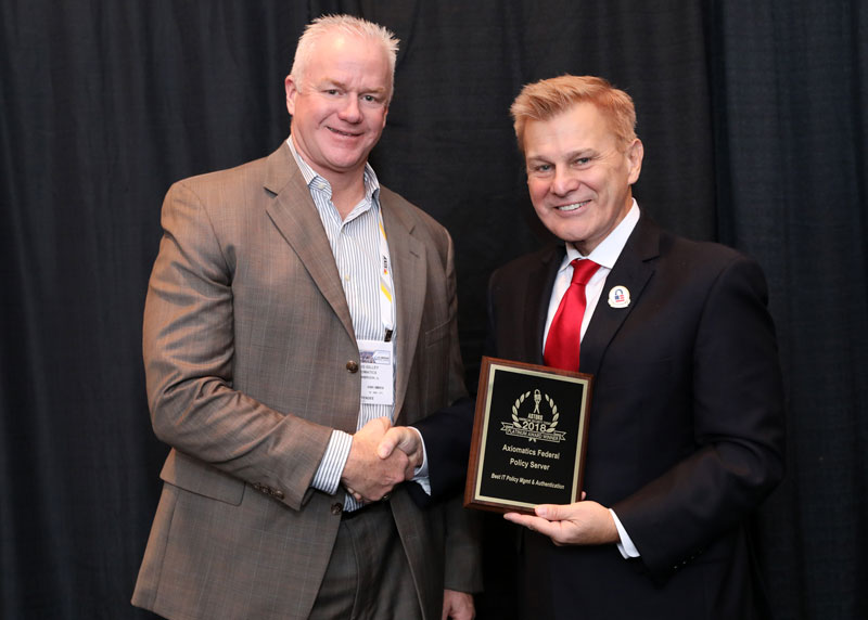 Craig Gilley, President, Axiomatics Federal accepting a 2018 'ASTORS' Platinum Award at ISC East