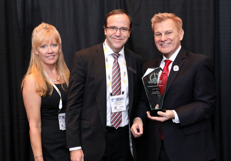 David Enderle, President of Automatic Systems America, accepting a coveted 2018 'ASTORS' Extraordinary Leadership Award at ISC East.