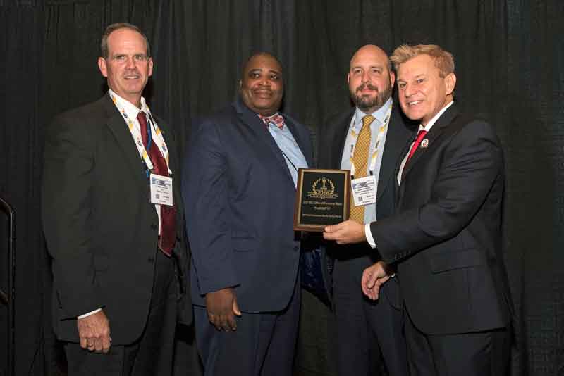 Reid Hilliard, Assistant Director, Department of Justice (DOJ), Kevin McCombs, Director of Security Services, US Office of Personnel Management (OPM) and John Rossiter, Senior Security Specialist, Securities and Exchange Commission (SEC) accepting a 2018 ‘ASTORS’ Homeland Security Award at ISC East.