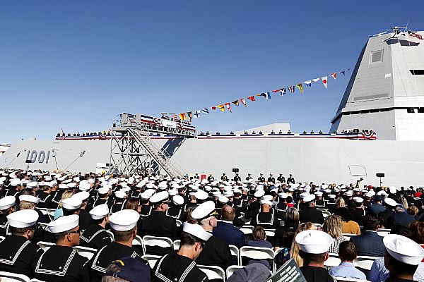 The crew of the Zumwalt-class guided-missile destroyer USS Michael Monsoor (DDG 1001) brings the ship to life during its commissioning ceremony, Jan. 26, 2019. (Courtesy of the U.S. Navy by Mass Communication Specialist 1st Class Peter Burghart)