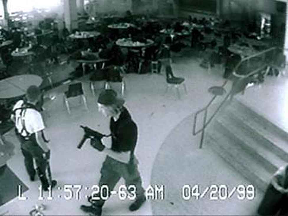 Eric Harris (left), and Dylan Klebold (right), the Columbine High School massacre shooters caught on the high school's security cameras in the cafeteria, 11 minutes before their suicides. (Courtesy of Wikipedia)