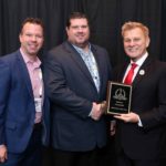 Dan Kuzniewski, Director of Marketing (center), with Douglas Miorandi, Federal Programs Director, accepting the 2018 Platinum ‘ASTORS’ Homeland Security Award for Best Metal/Weapons Detection Solution at ISC East.