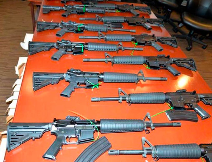 This undated photo provided by the United States Department of Justice in Indiana shows .223 caliber rifles manufactured by Mahde and Moyad Dannon in Indiana, including six fully-automatic weapons intended for shipment to the Middle East to support ISIS. (Courtesy of the U.S. Department of Justice)