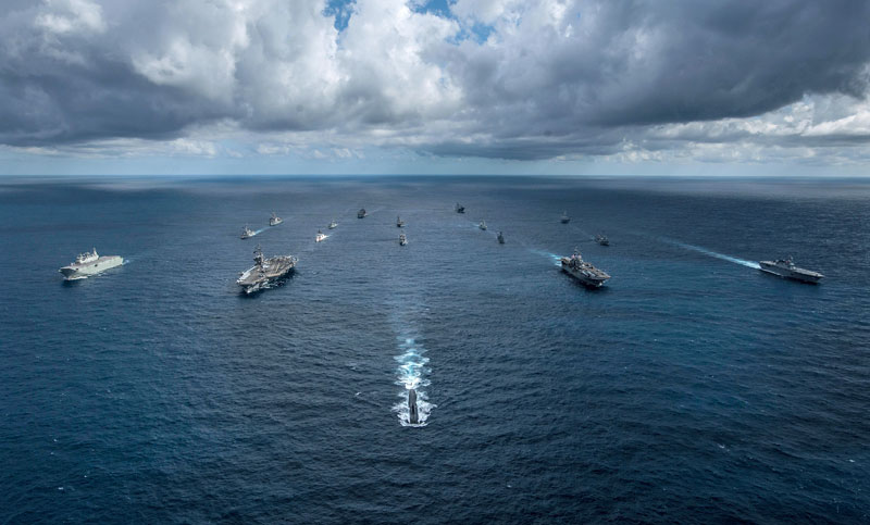 The Los Angeles-class attack submarine USS Key West (SSN 722) leads the Royal Australian Navy amphibious assault ship HMAS Canberra (L 02), left, the aircraft carrier USS Ronald Reagan (CVN 76), the amphibious assault ship USS Wasp (LHD 1), and the Japan Maritime Self-Defense Force helicopter destroyer JS Ise (DDH 182) in formation with 12 other ships from the U.S. Navy, U.S. Coast Guard, Royal Australian Navy, Royal Canadian Navy and Japan Maritime Self-Defense Force (JMSDF) during Talisman Sabre 2019. Talisman Sabre illustrates the closeness of the Australian and U.S. alliance and the strength of the military-to-military relationship. It is the eighth iteration of this exercise. (Courtesy of the U.S. Navy, and Mass Communication Specialist 2nd Class Kaila V. Peters)
