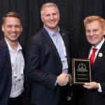 Matthew Moreno, Lenel Regional Manager (at left), and Ryan Kaltenbaugh, VP of Strategic Marketing & Communications and Federal Government Solutions at LenelS2, accepting a 2018 ‘ASTORS’ Award at ISC East