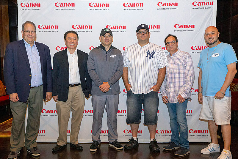 Wayne Chrebet (3rd from left), poses with guests Orlando Lago, Joe Viera, and Anthony Wartel of Marymount School of New York, Edward Chang of Phibro Animal Health Corporation, and Steven Greenbaum of Altigro Benefit Services, Inc. (Courtesy of Canon Solutions America)
