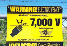 Warning signs are displayed on EGD solar electric fences, warning to inform criminals that 7,000 volts are delivered by EGD solar powered electric fences. 