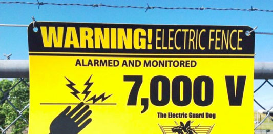 Warning signs are displayed on EGD solar electric fences, warning to inform criminals that 7,000 volts are delivered by EGD solar powered electric fences. 