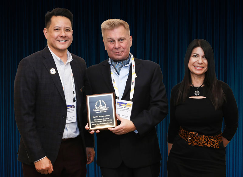 Miguel Lazatin, Senior Director of Marketing at Hanwha Techwin, and Monique Merhige, President at Fusion Media Marketing/Infusion Direct Marketing, accepting a 2019 ‘ASTORS’ Award for Best IP Video Surveillance Solution, at the Annual ‘ASTORS’ Awards Presentation Luncheon held each November in New York City.