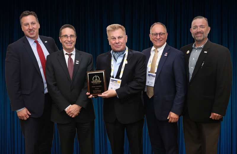 Rick Cadiz (left to right); David Antar, President; Mike Madsen; AST Publisher, Frank Jacovino; and Jack Plunkett, CTO of IPVideo Corp accept One of Three 2019 ‘ASTORS’ Awards from Madsen at ISC East.