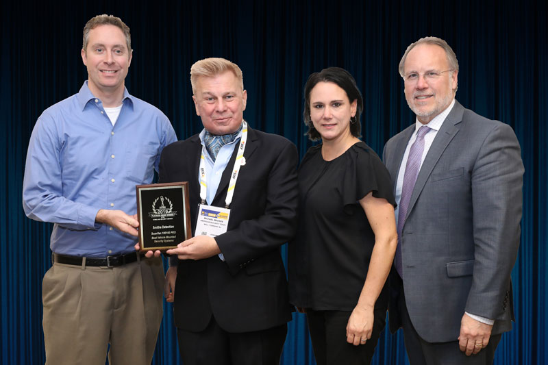 Michael Burrows, Marketing Communications Manager, Dana Knox-Gower, Director of Communications and Marketing, Americas, and Jamie Edgar, Director of Homeland Security Systems at Smiths Detection, accepting the company’s 2019 ‘ASTORS’ Award in New York City.