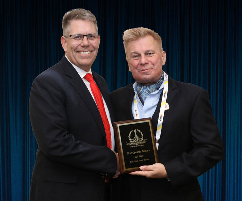 SOS (Siren Operated Systems) President, McKay Lundgren, accepting the company's 2019 'ASTORS' Platinum Award at the Awards Banquet at ISC East.