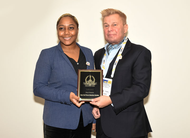 LaRel Rogers, Vertical Marketing Manager, Detection at FLIR Systems accepting the FLIR 2019 'ASTORS' Award at ISC East.