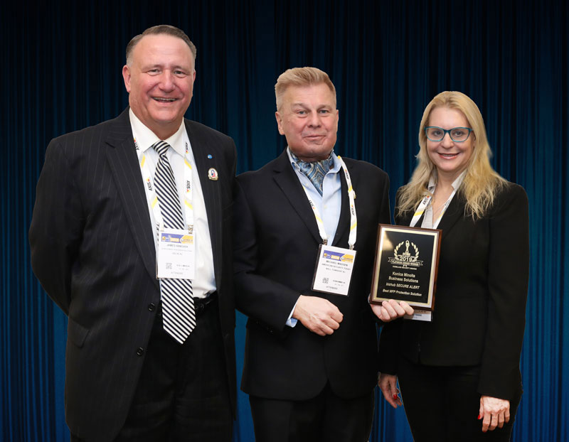 James Hanover, Konica Minolta Business Solutions Consultant, and Stephanie Keer, PhD, Director of National Practice and Gov’t, accepting a 2018 ‘ASTORS’ Award at ISC East.