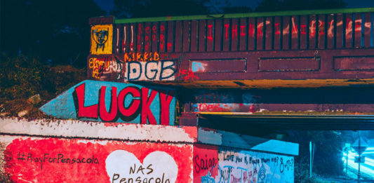 The Graffiti Bridge over 17th Avenue just before midnight on December 6, 2019 following the events at NAS Pensacola. Painted by a local resident. (Courtesy of Wikipedia.)